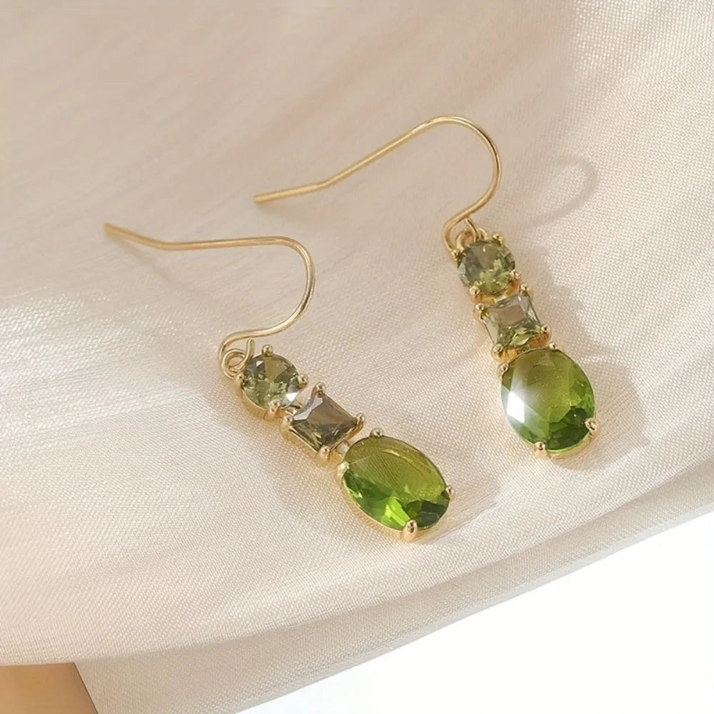 A pair of green copper geometric earrings with a quadrilateral shape and retro bohemian style.