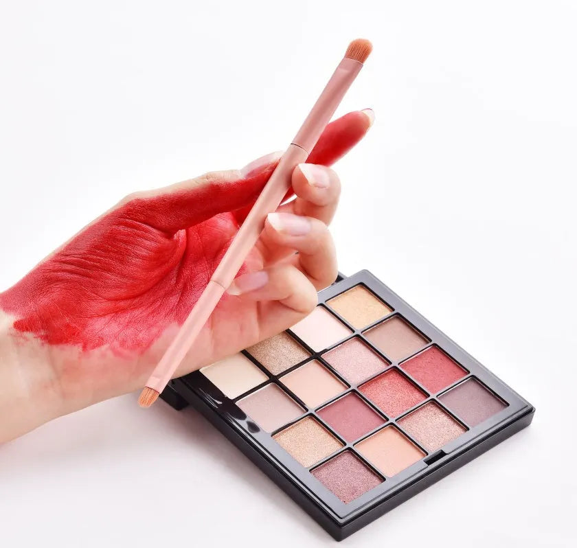 10 professional makeup brushes with wooden handles in a pink case including foundation, powder, and dual-ended brushes
