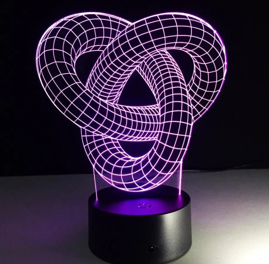 Knot 2 3D optical illusion LED lamp hologram with remote control and touch operation on a table