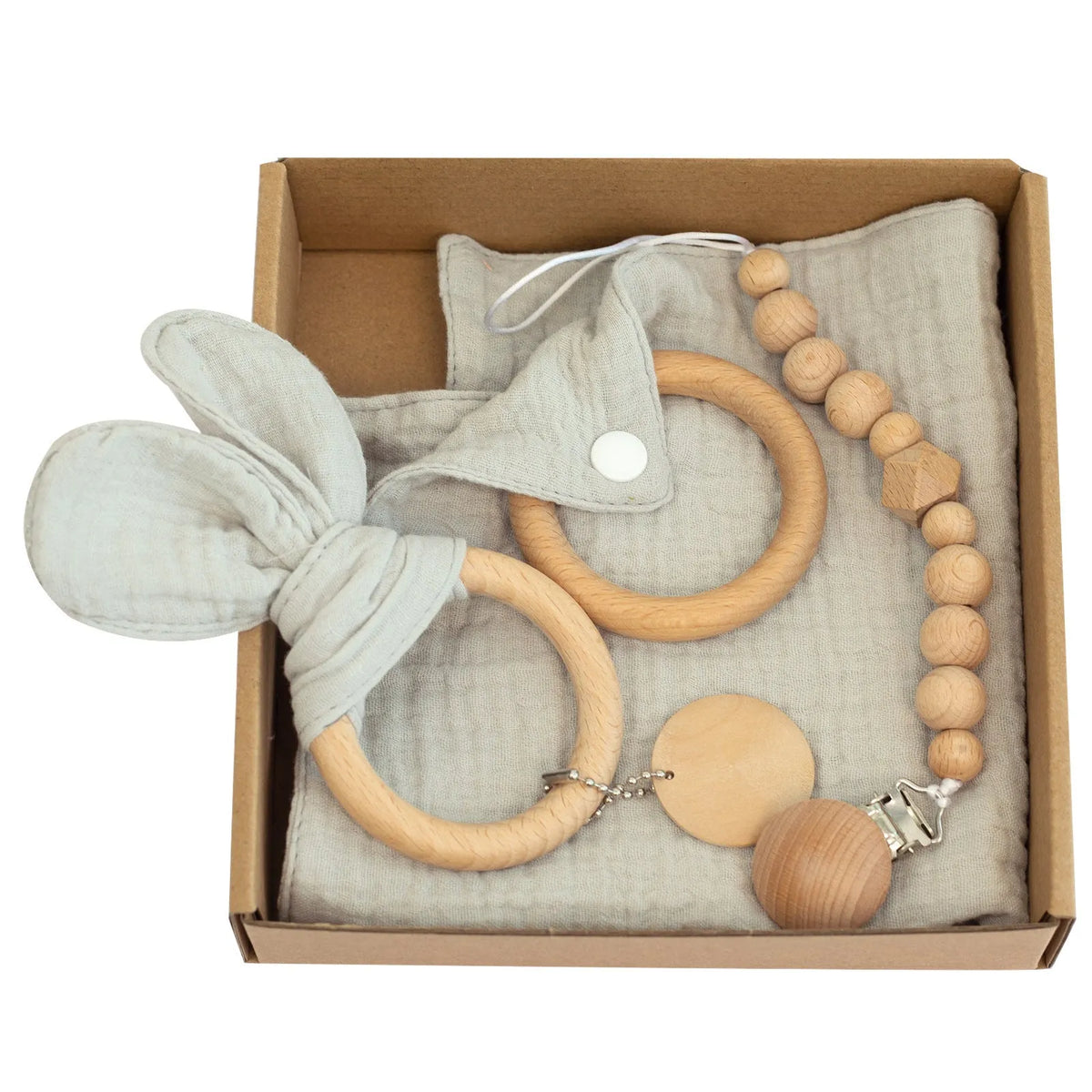 Baby teething toy gift set with bamboo blend gauze blanket, wooden beech bell, teether, brush, and milestone marker.