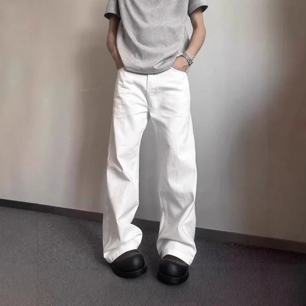 Men's white straight-leg jeans with loose fit and mid-waist cut