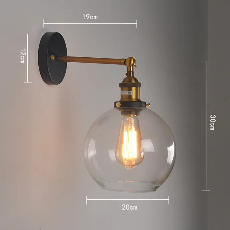 Round glass wall lamp with aluminium holder in transparent, amber, or smoky grey colour options