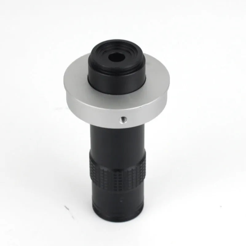 Black anodised aluminium industrial camera monocular lens for high-magnification inspection.