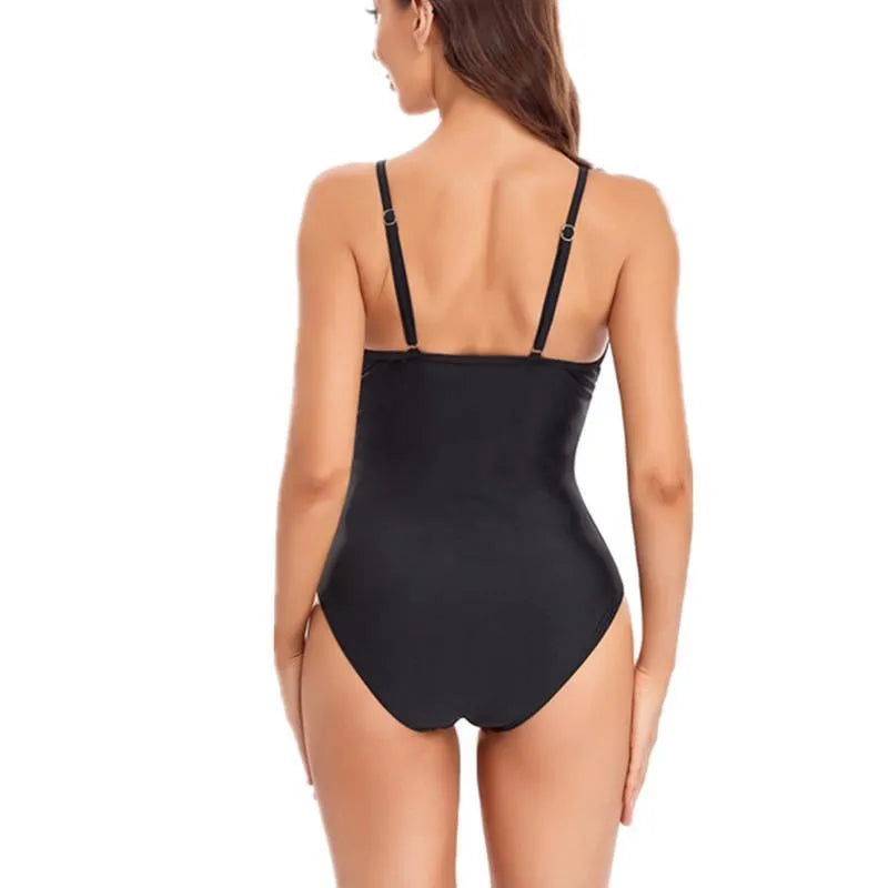 Ladies' solid colour one-piece swimsuit with mesh panel and backless design.