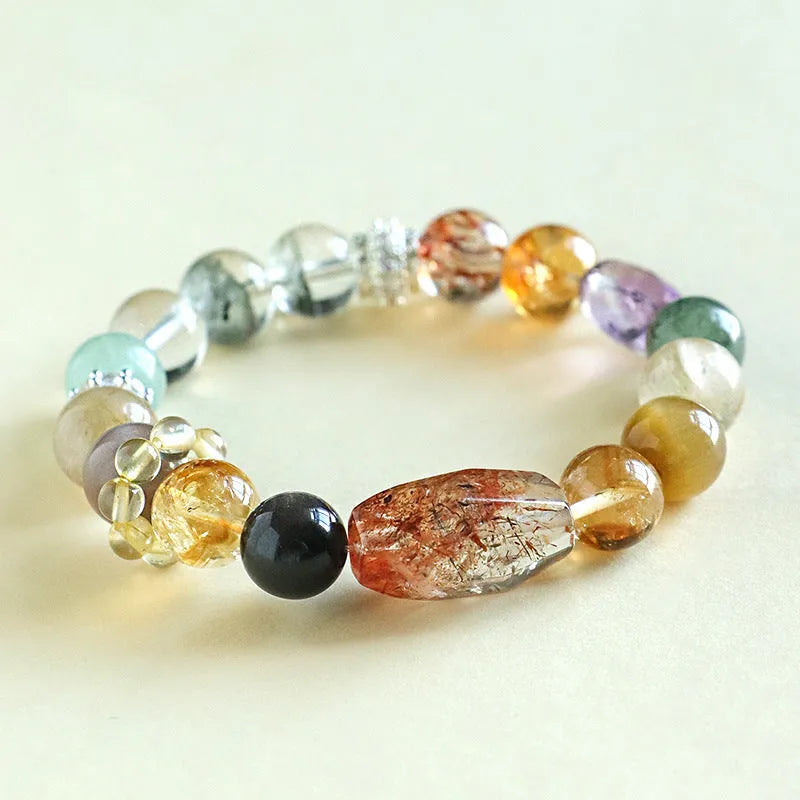 Women's natural crystal bracelet with black gold beads and adjustable slip knot closure.