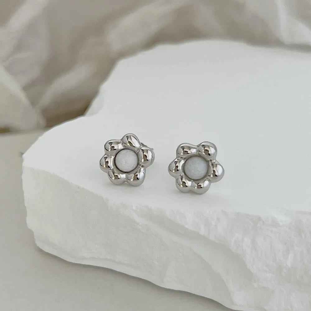 Pair of S925 sterling silver ear studs with black agate flower centre, gold colour, simple geometric shape