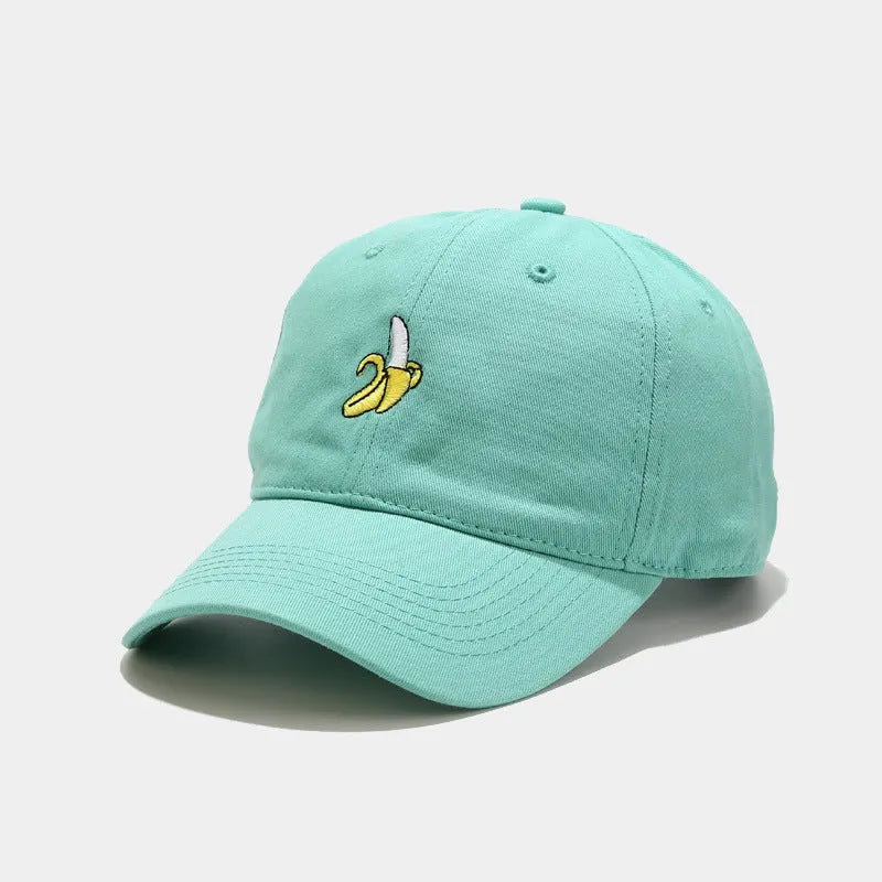 Adjustable baseball cap with cute banana embroidery in seven colour options on soft polyester fabric