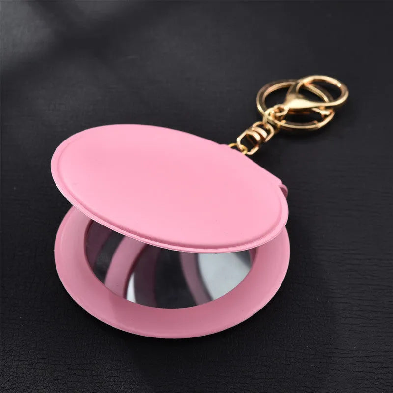 Small round makeup mirror with PU leather frame and golden buckle in 8cm size