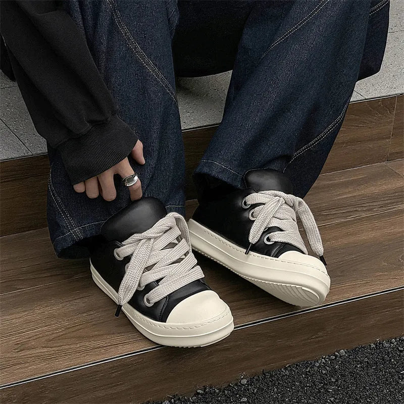 Men's black casual slip-on shoes with front lace-up and rubber sole