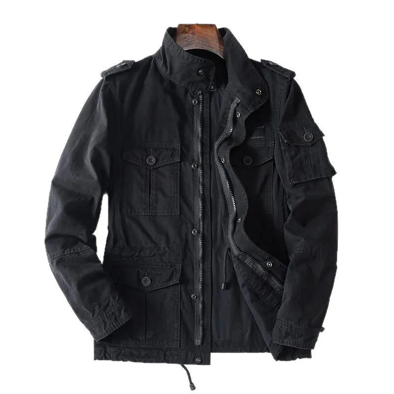Man wearing a loose-fit light brown cotton twill zip-up jacket with a retro style.