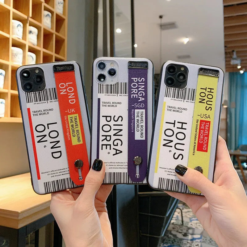Red TPU and PC iPhone case with a built-in wristband, shown next to violet and yellow colour options.