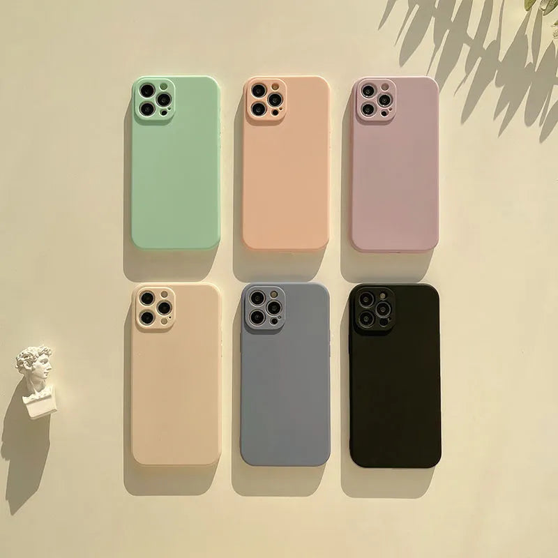 Frosted silicone phone case for iPhone 14 in slate blue colour showing matte texture and precise cutouts.