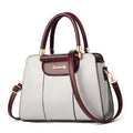 Ladies large horizontal square PU handbag with zipper closure and stitching detail in beige
