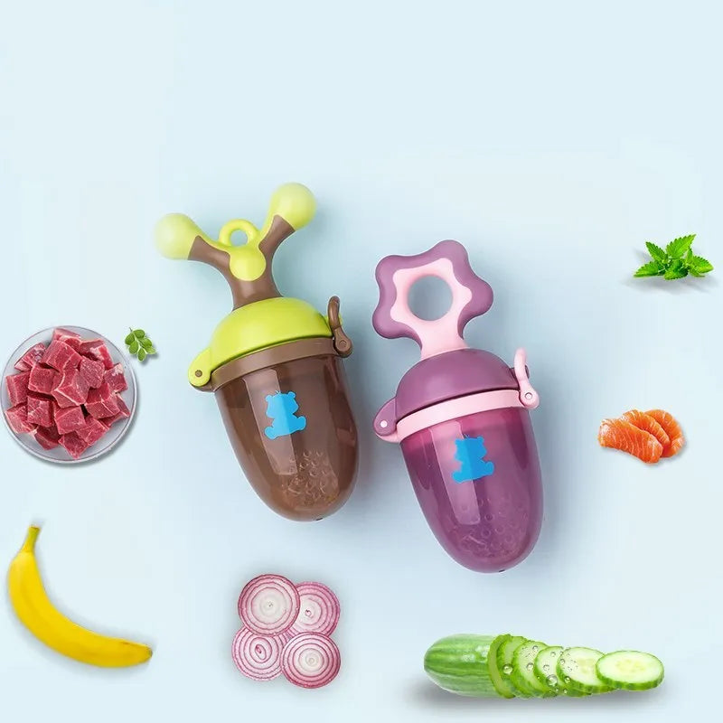 Green and purple baby bite trainers with textured surfaces and easy-grip handles