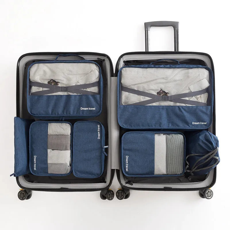 Seven-piece waterproof travel tote bag set in black and gray with six sorting bags and cation hardware