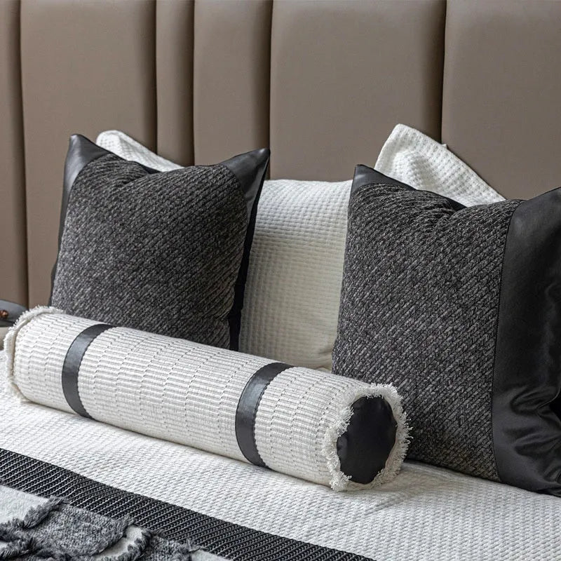 Modern minimalist grey and white plaid polyester bed runner set with pillowcase and round pillow on a bed.
