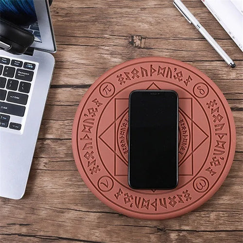 Square 25cm 10W fast wireless phone charger with glowing magic array pattern in black on a desk