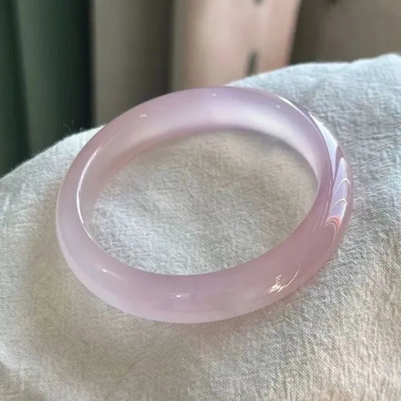 Natural agate wide tyre bracelet showing pink stone beads with six size options from 52mm to 62mm internal diameter
