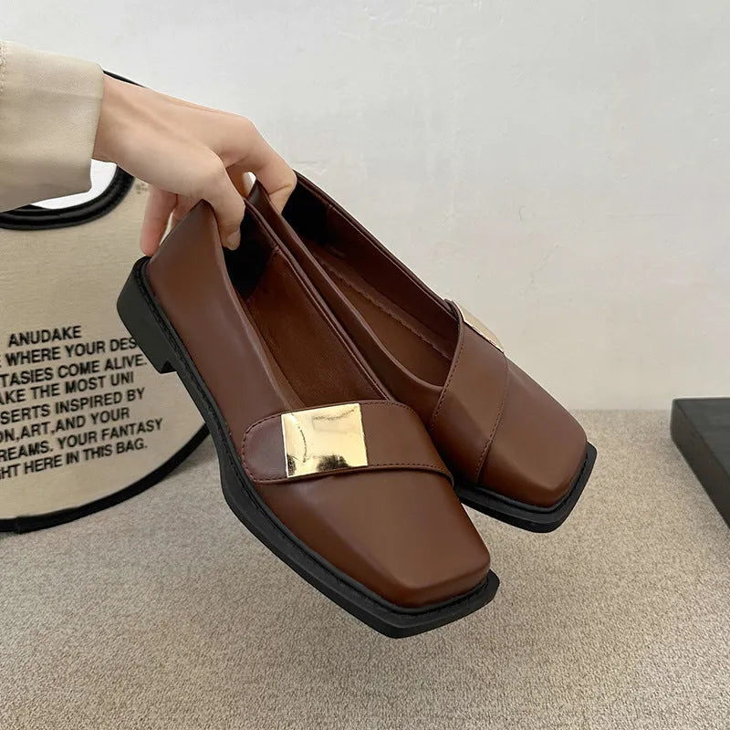 Women's beige artificial leather square toe flat-heeled slip-on ankle boots with a metal buckle.