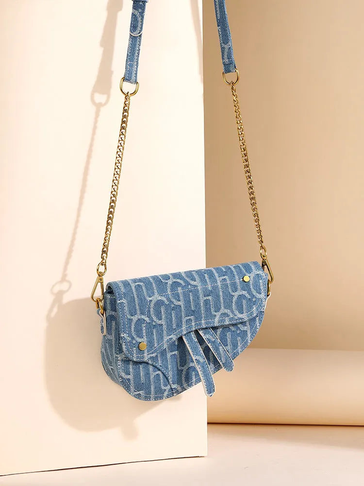 Women's vintage denim saddle bag in blue cross body bag with soft PU surface and zip pocket interior