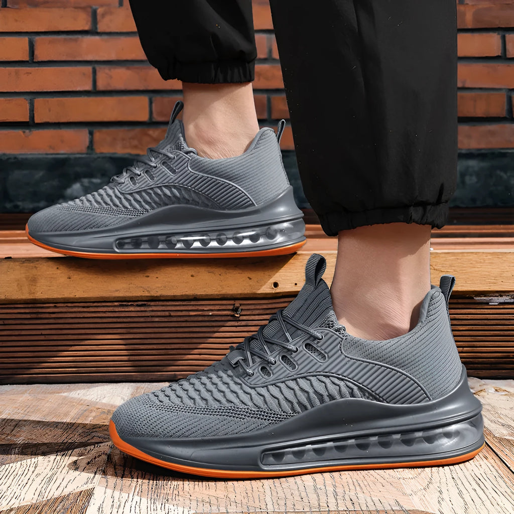 Men's black mesh running shoes with low top, round toe, and lace-up design on rubber sole