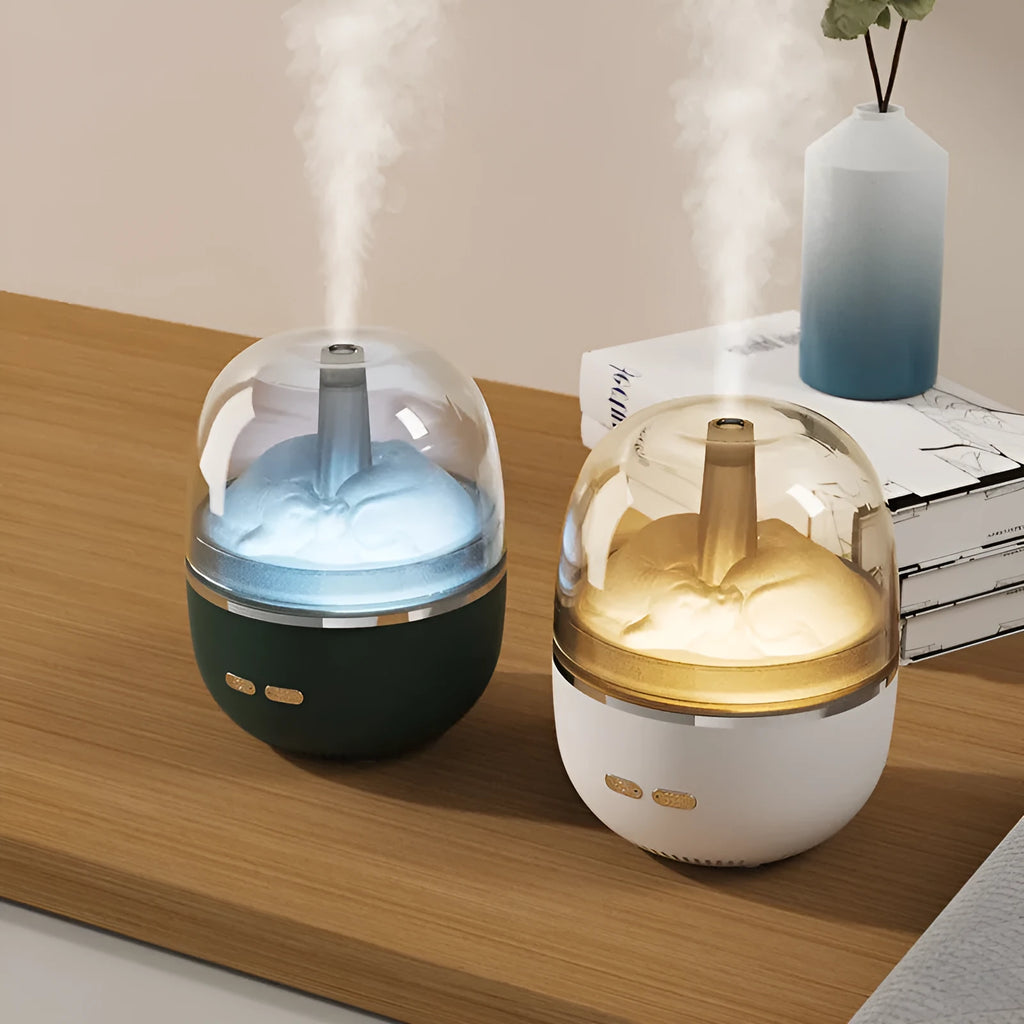 Green ultrasonic humidifier with colourful gradient light on desk showing heavy mist output