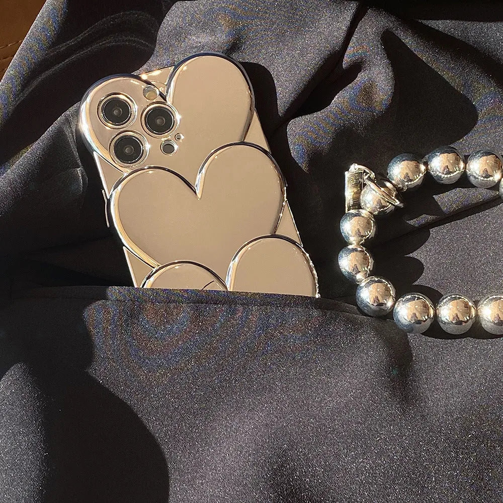iPhone case with a 3D electroplated red love heart on a solid colour TPU soft shell.