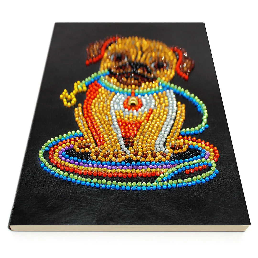 Black A5 hardback diamond painting notebook showing closed cover and spine.