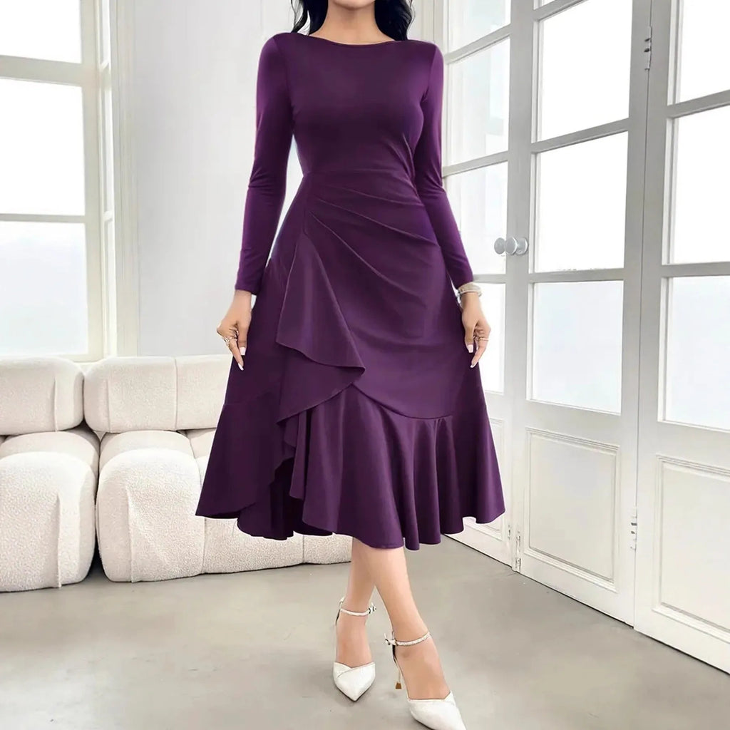 Purple women's long sleeve pullover dress with ruffles at the mid waist.