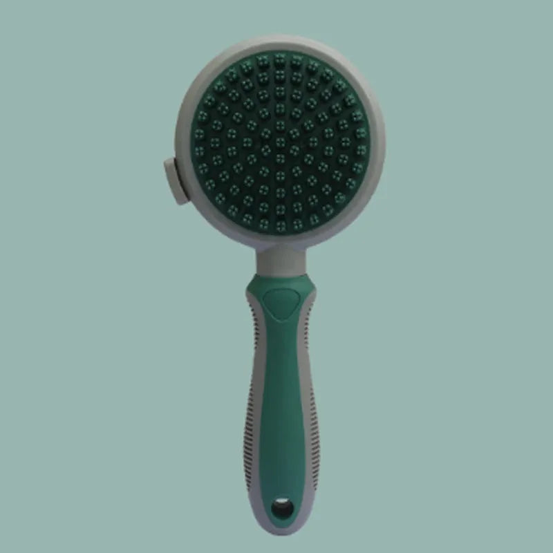 Green and pink dual-sided pet brush showing slicker brush side and silicone massage head side