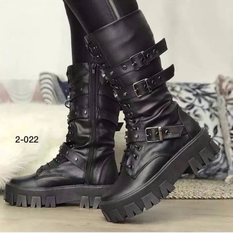 Black mid-calf women's boots with a large metal buckle and side zip on a white background.