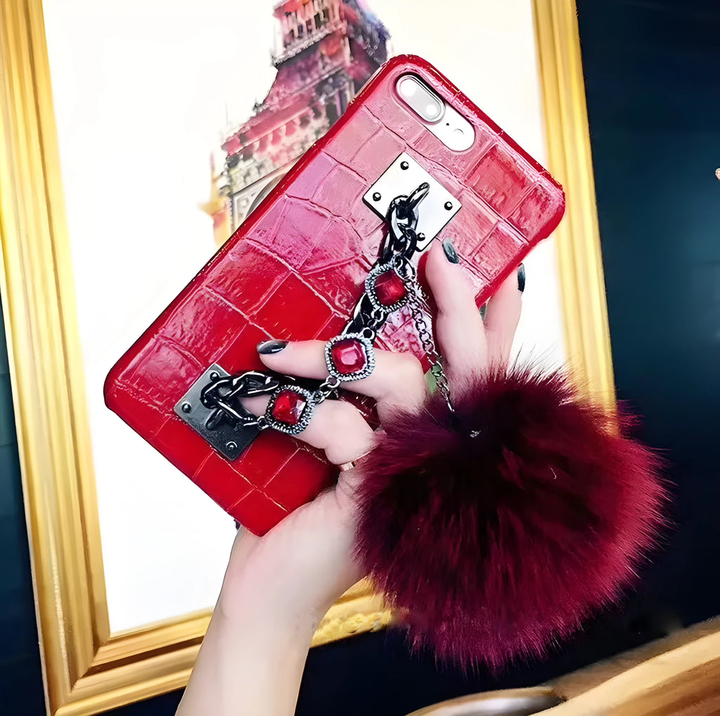 PU leather iPhone case with fox fur ball and rhinestone studs, compatible with iPhone 6, 6s, 7, 8, Plus, and X.