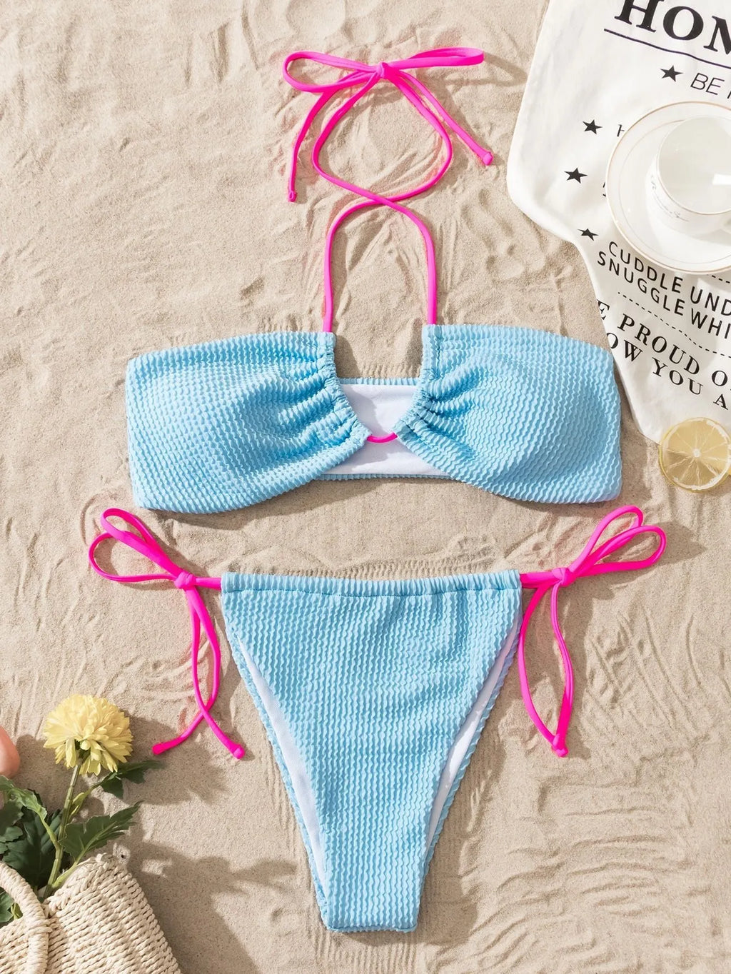 Solid colour women's halter neck lace-up bikini set with backless design on a mannequin
