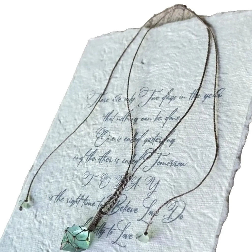 Artificial crystal rough labradorite-style pendant necklace with O-link chain on display