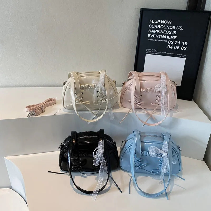 Casual ladies shoulder handbag with bandage bow detail in PU material showing mobile phone compartment