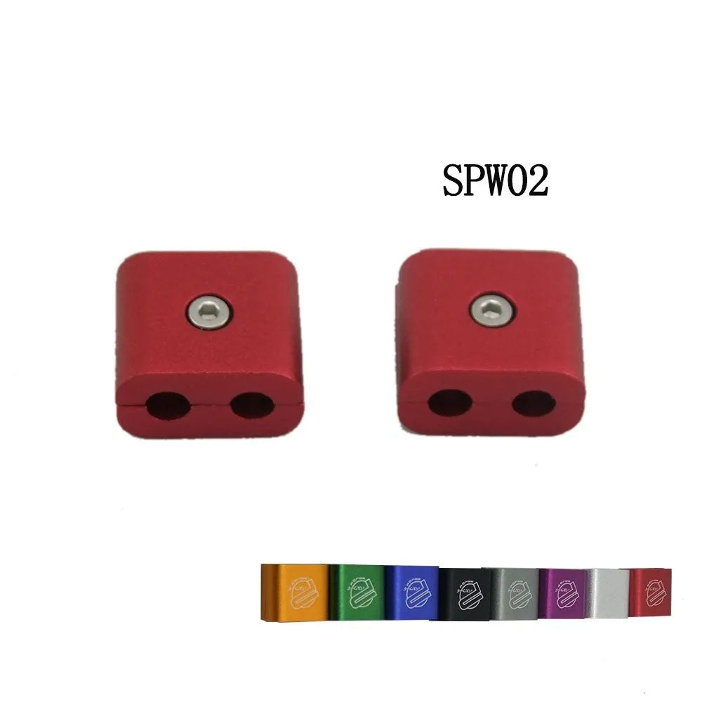 Metal three-piece car modification fastening clamp in assorted colours on a black background.