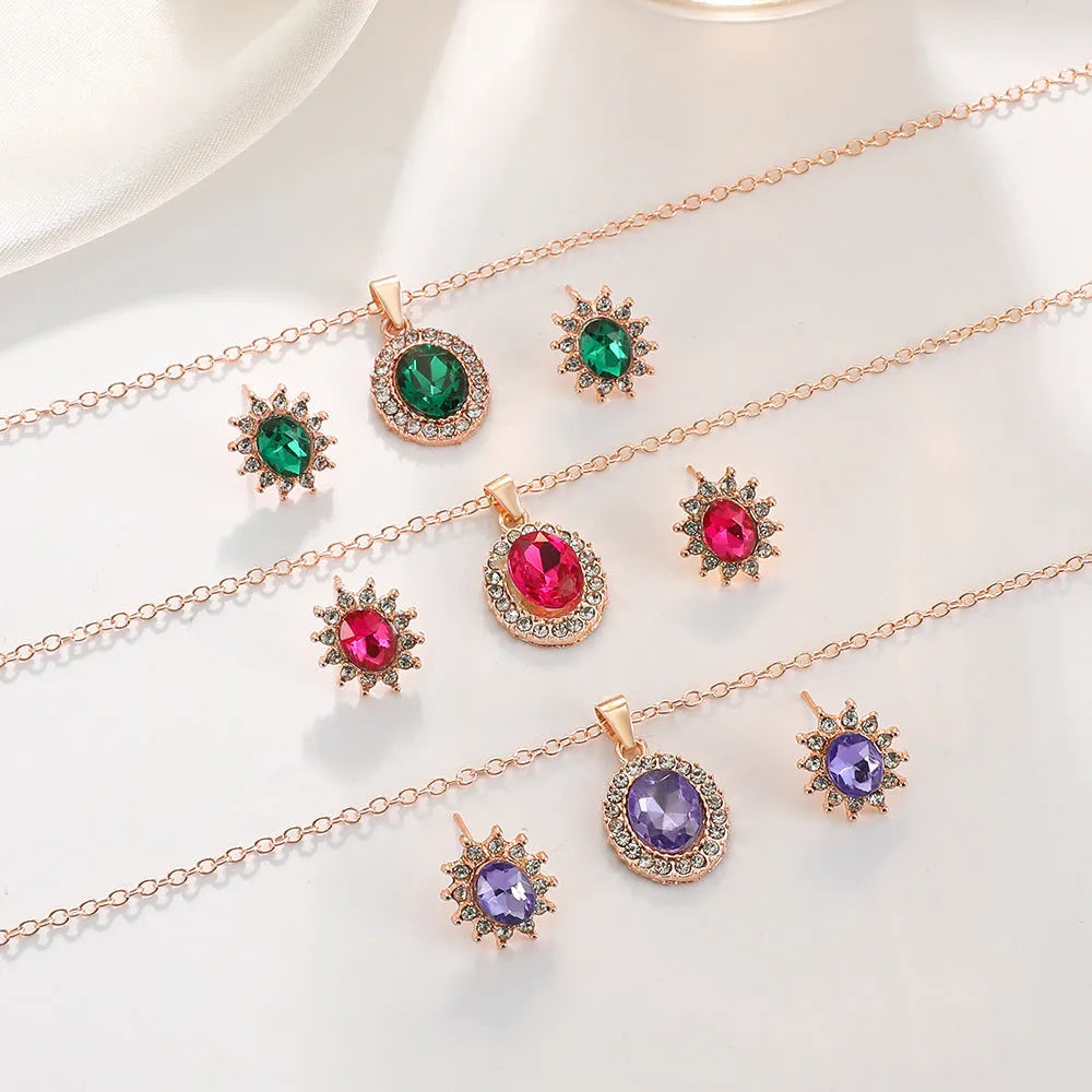 Rose gold sunflower earrings and necklace set for women on white background