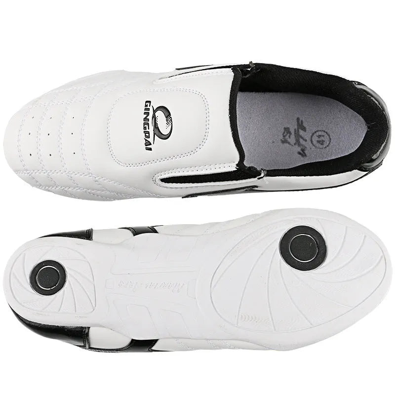 Black and white children's martial arts training shoes with a soft bottom and widened fit for Sanda and Taekwondo.