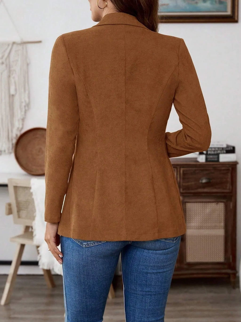Brown single-breasted lapel coat for men with long sleeves, shown on a hanger.