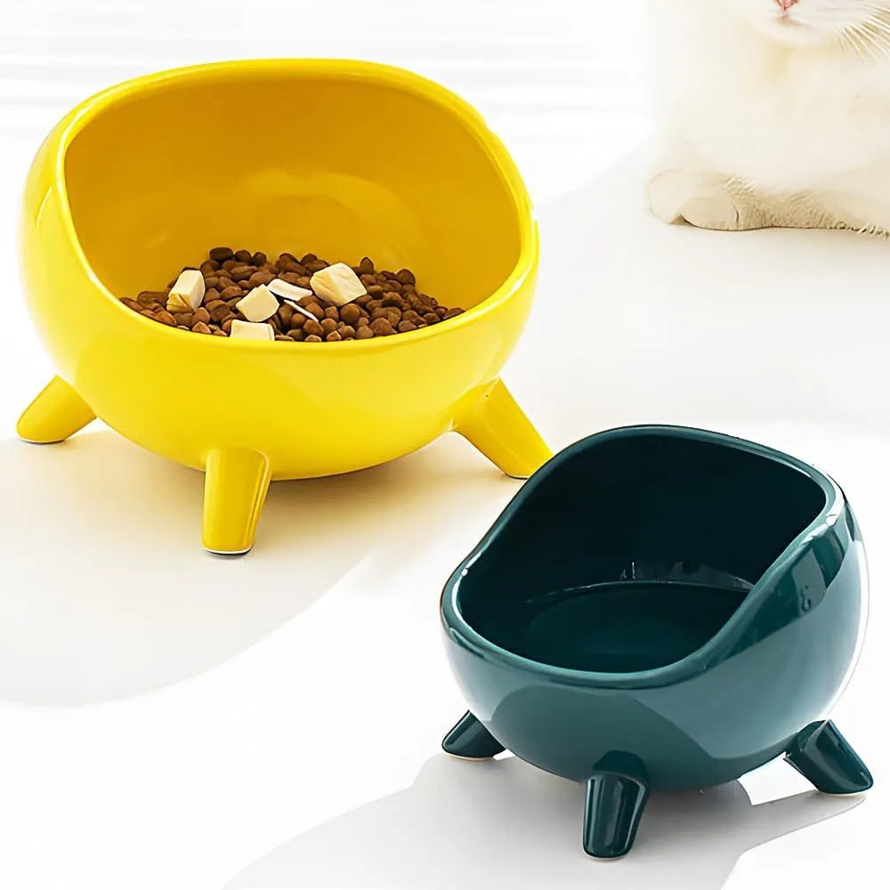 Green ceramic pet food bowl with four legs and wide mouth opening for cats and small dogs