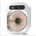 Green and white portable USB misting fan with water tank and adjustable air vent on a desk.