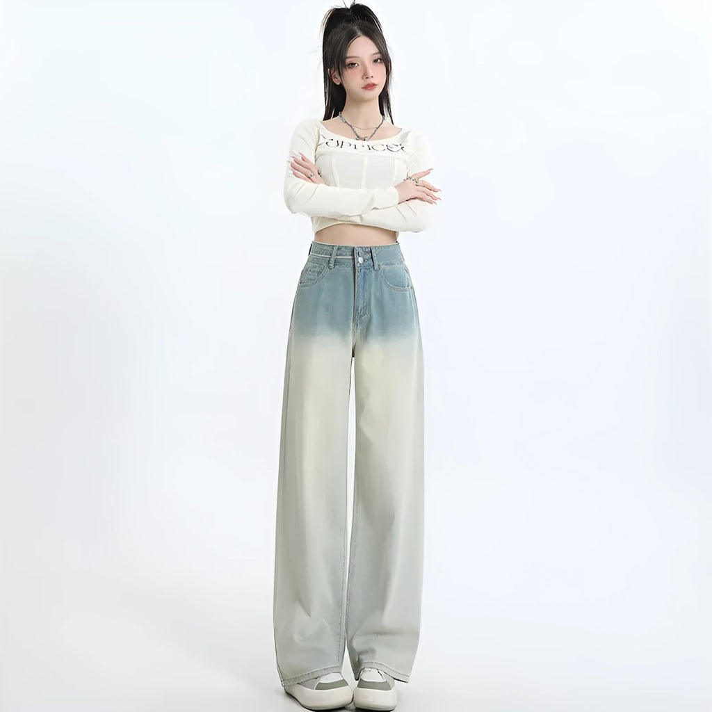 Women's gradient blue straight-leg denim trousers showing colour gradation effect and contemporary cut