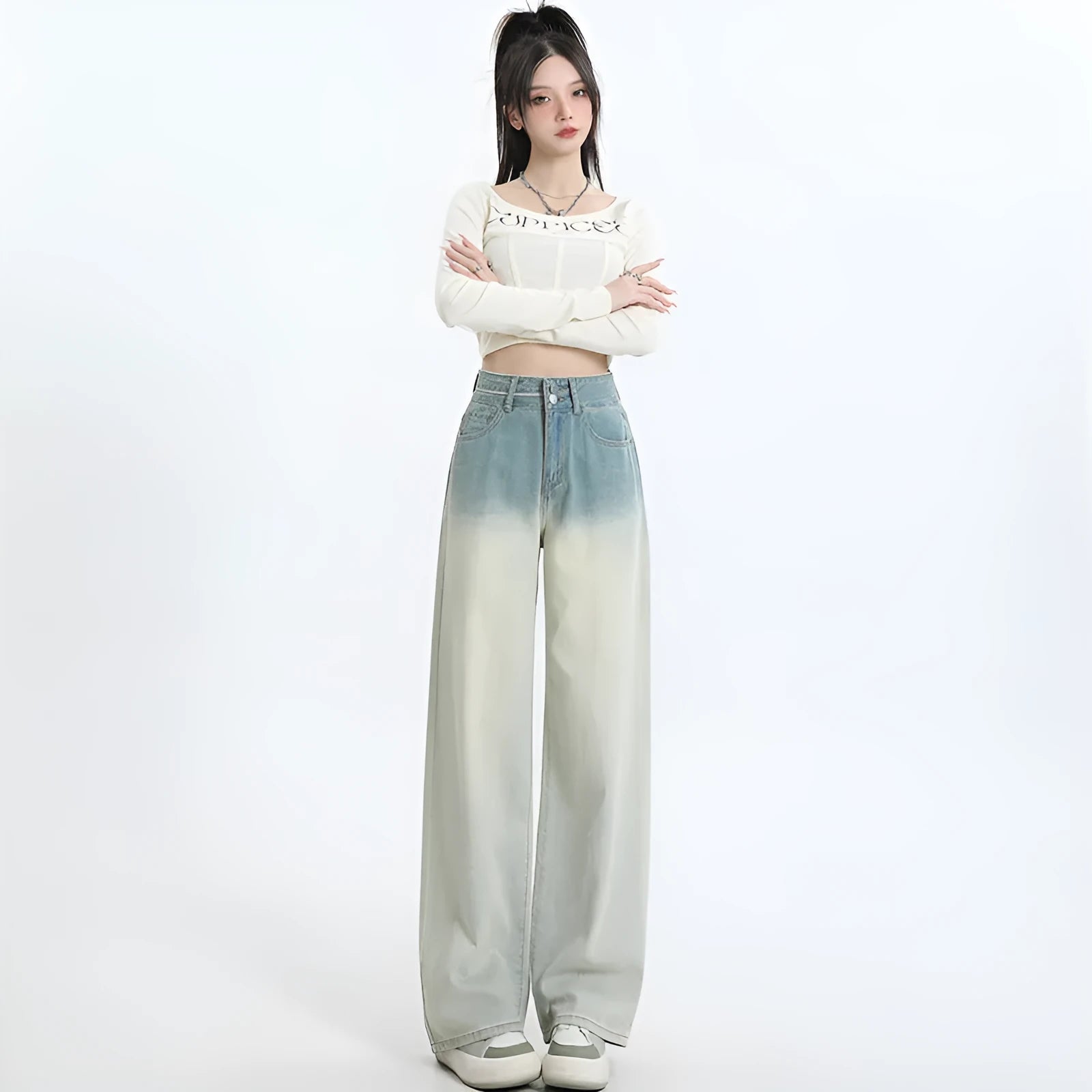 Women's gradient blue straight-leg denim trousers showing colour gradation effect and contemporary cut