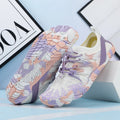A pair of quick-drying lace-up beach shoes in a mesh material with a rubber non-slip sole.