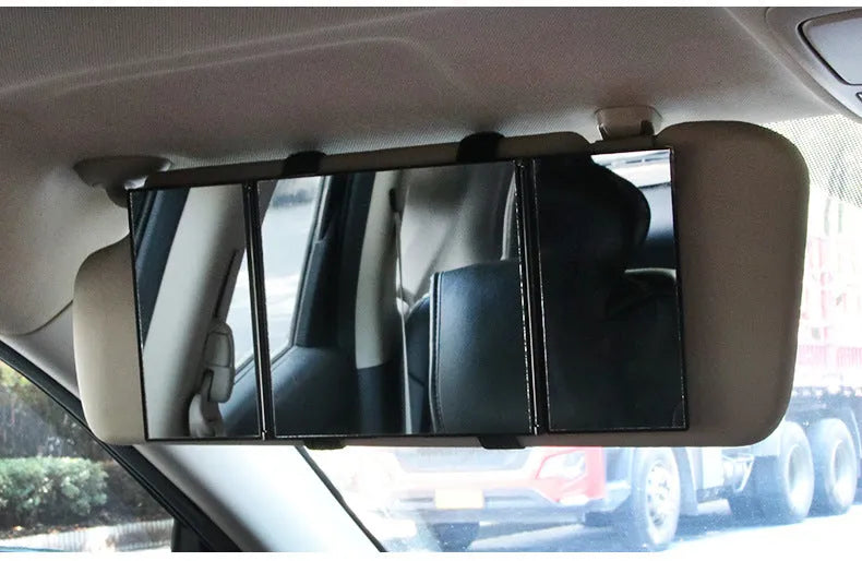 Silver car folding makeup mirror shown closed at 15.5cm and open at 30.5cm wide.