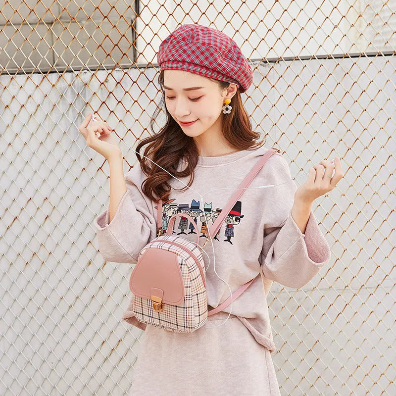 A PU phone bag shown in one of five colour options, demonstrating diagonal shoulder carry.