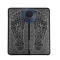 Leather foot massage cushion with a separate wireless remote control on a wooden floor
