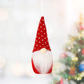 Christmas knitted small pendant in red style A made from non-woven fabric on a tree branch