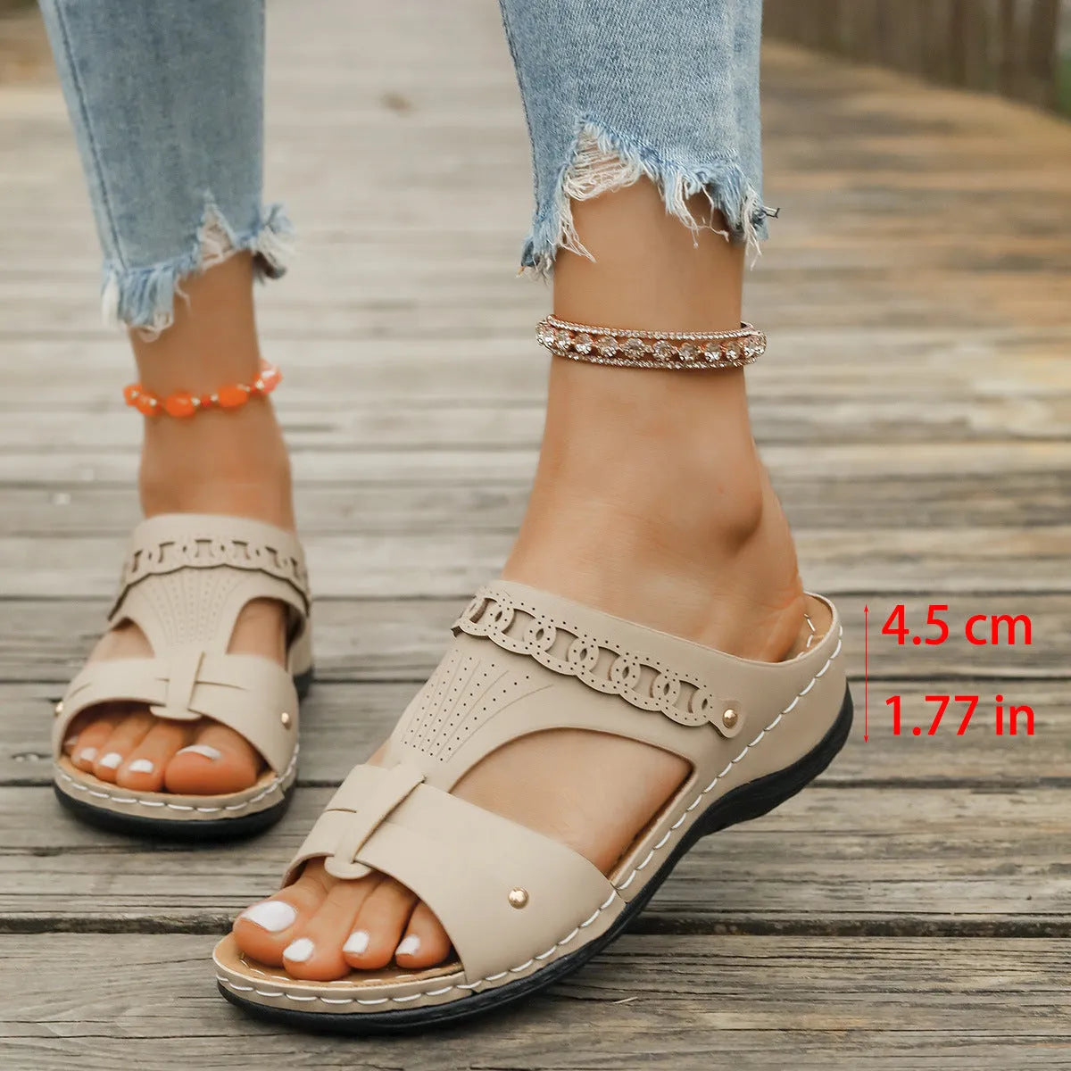 Pair of blue Roman-style slope heel slippers showing fish mouth toe holder design.