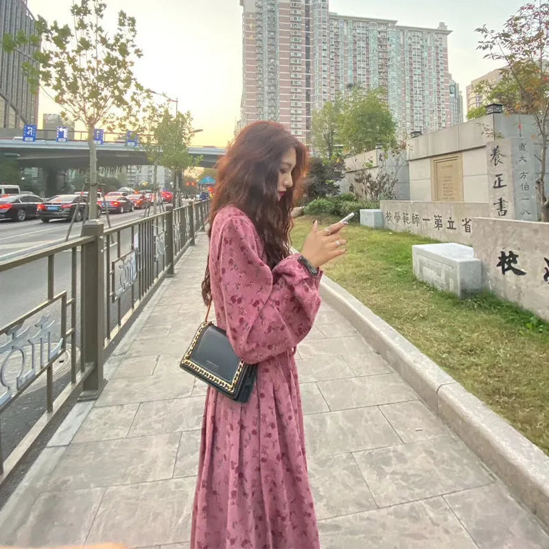 Red knitted cotton floral dress with princess sleeves and an elastic high waist.